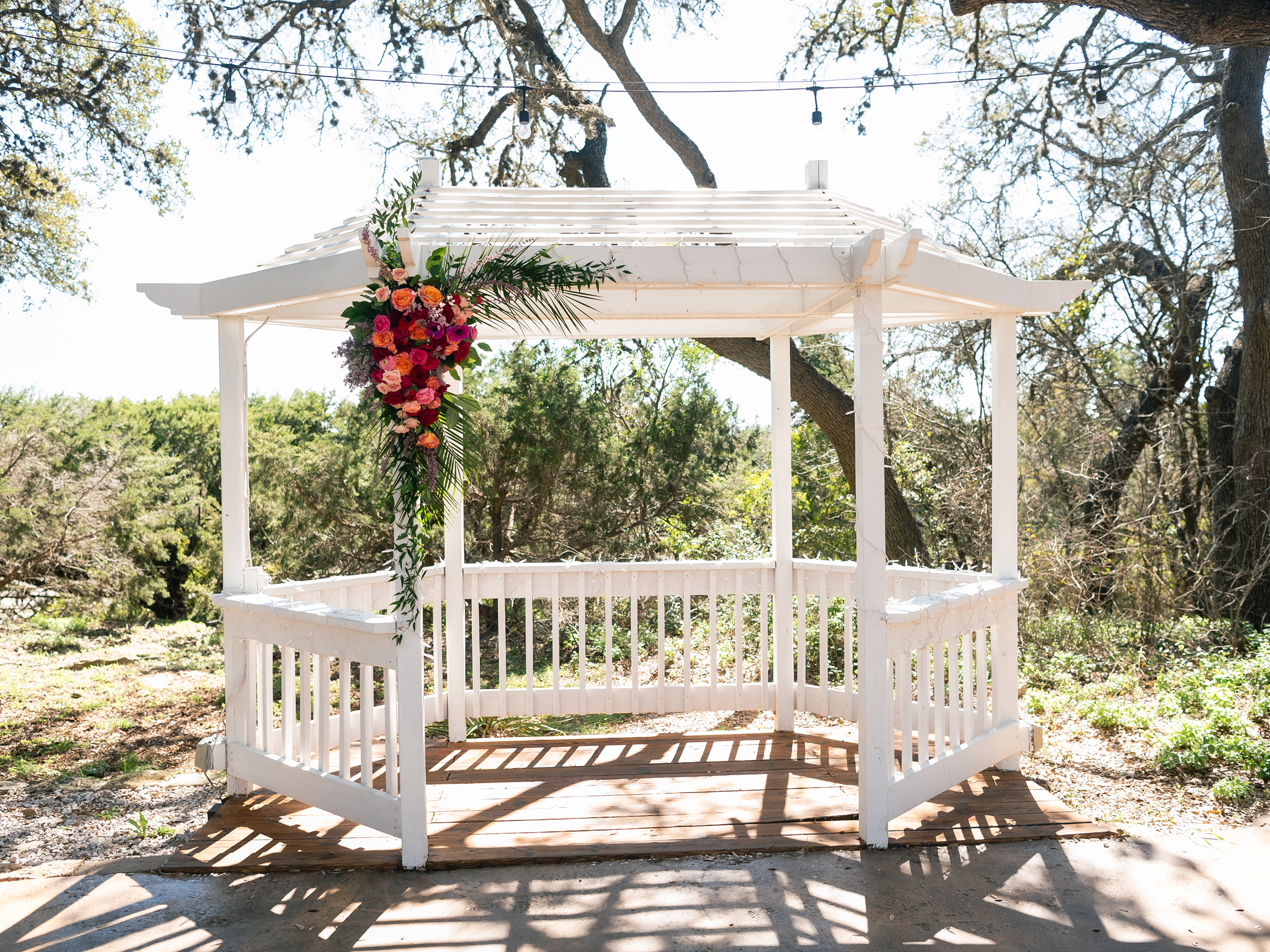 The gazebo dressed with a cascade of roses