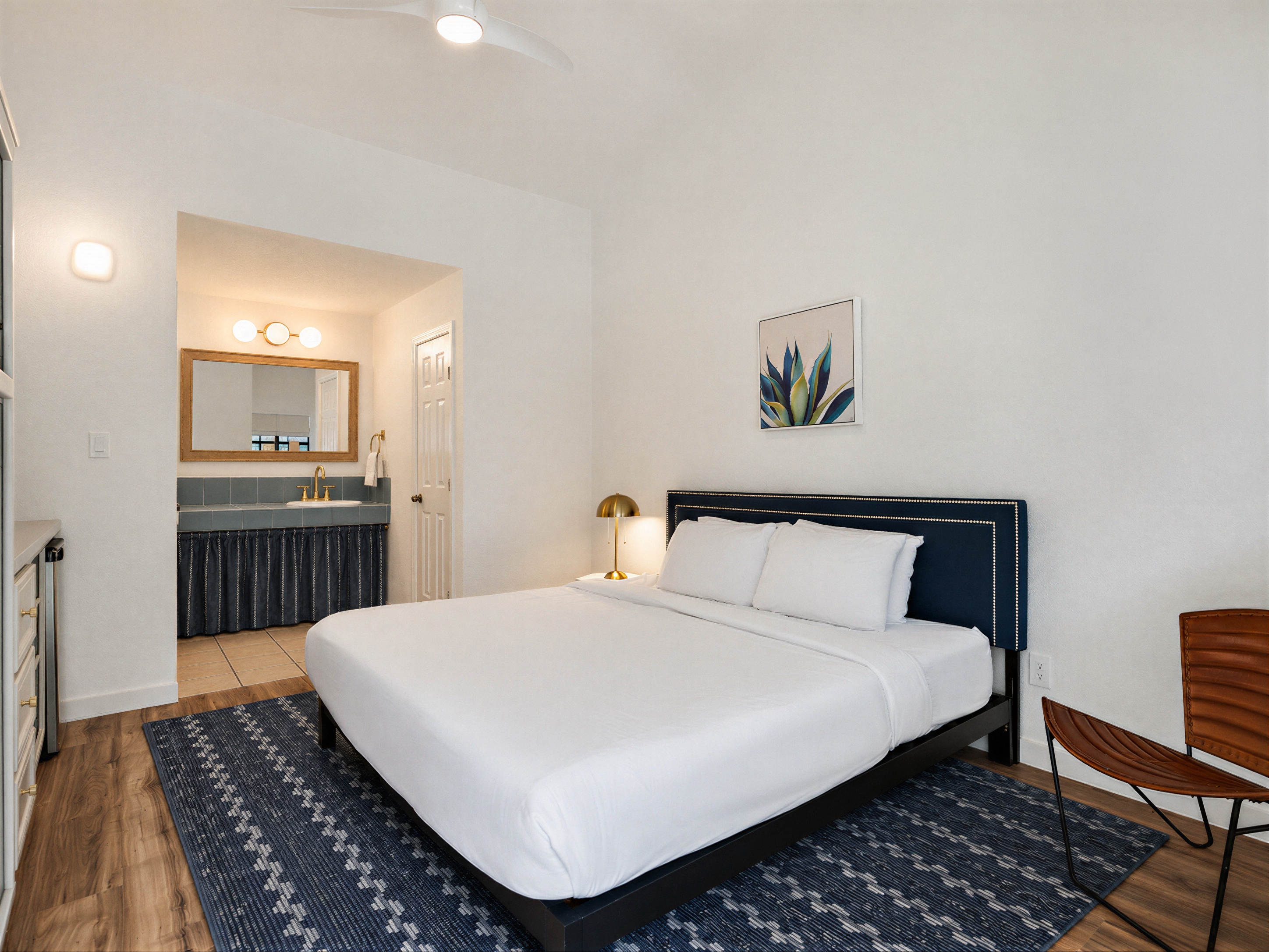Deluxe King room with a navy headboard