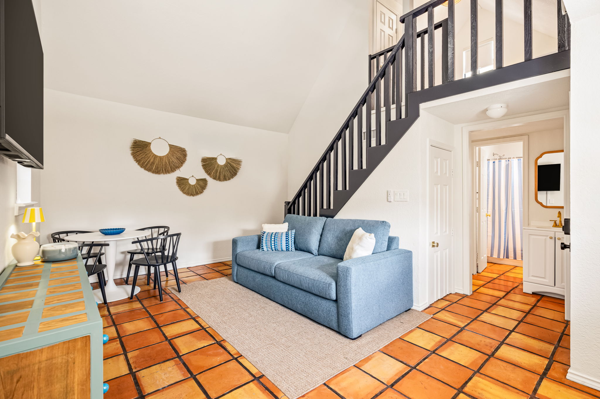 One Bedroom Suite with Loft bedroom under a ceiling fan