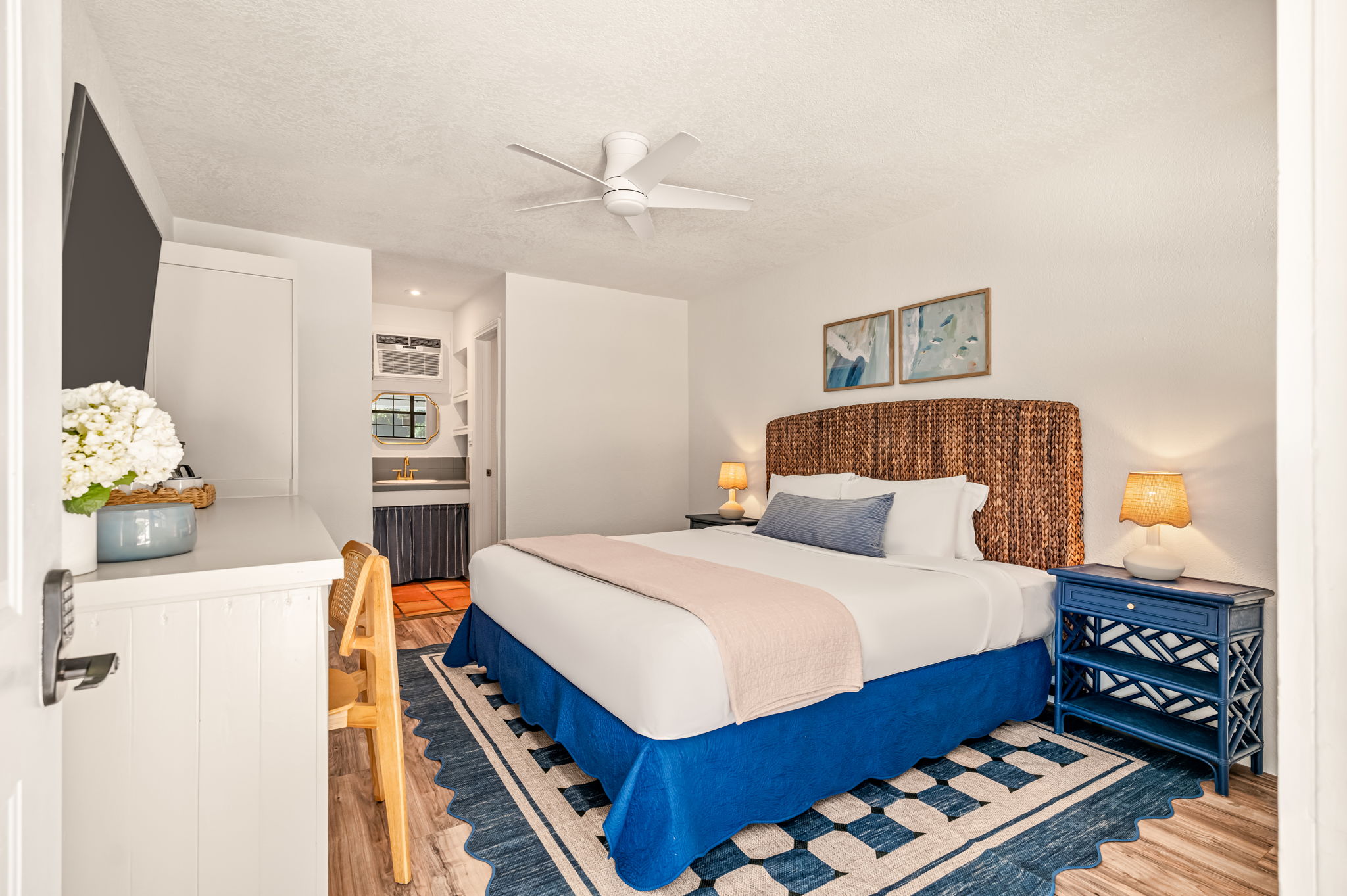 Standard King room with a king bed and wood floors