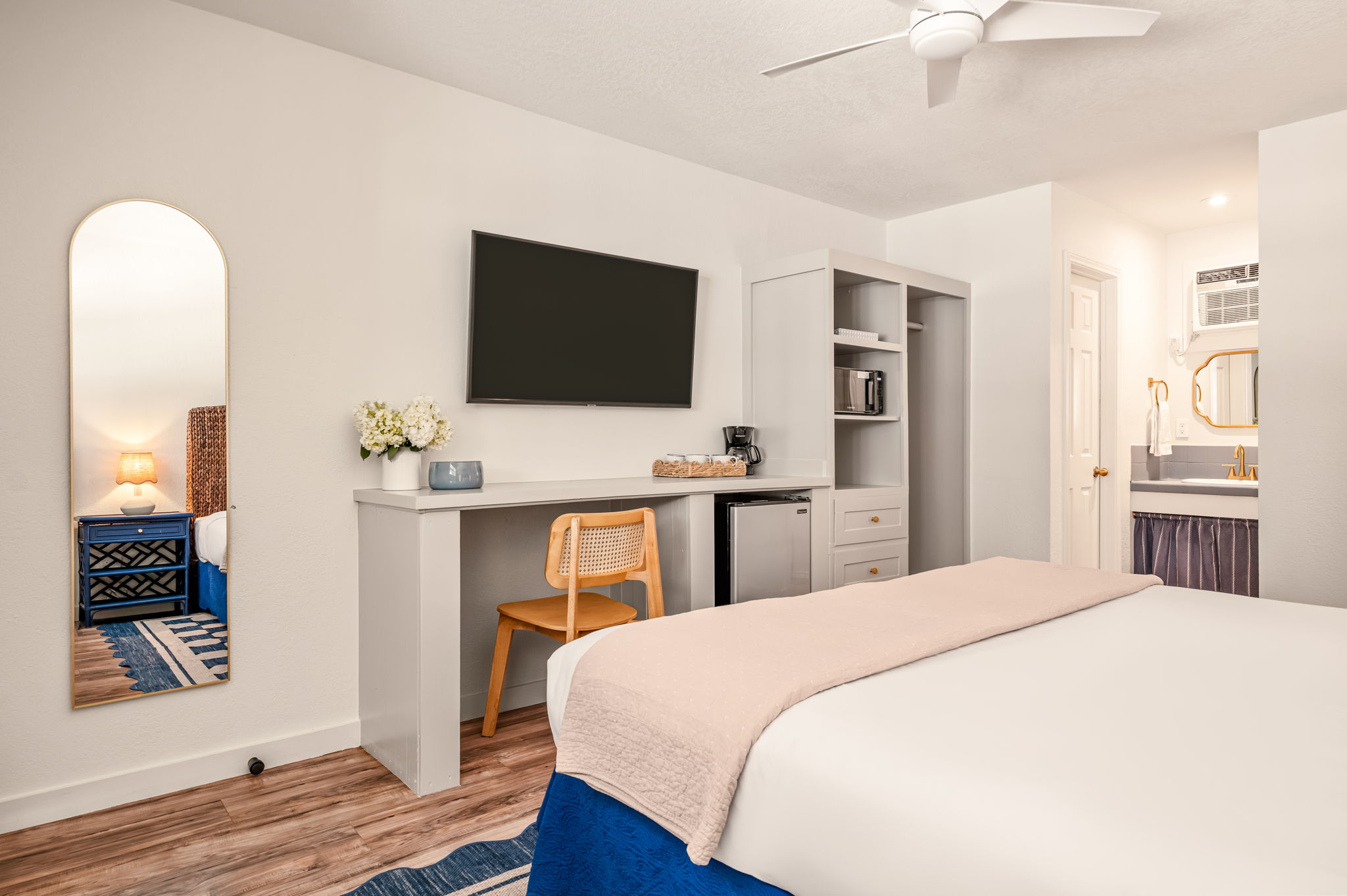 Standard King room with a king bed and wood floors