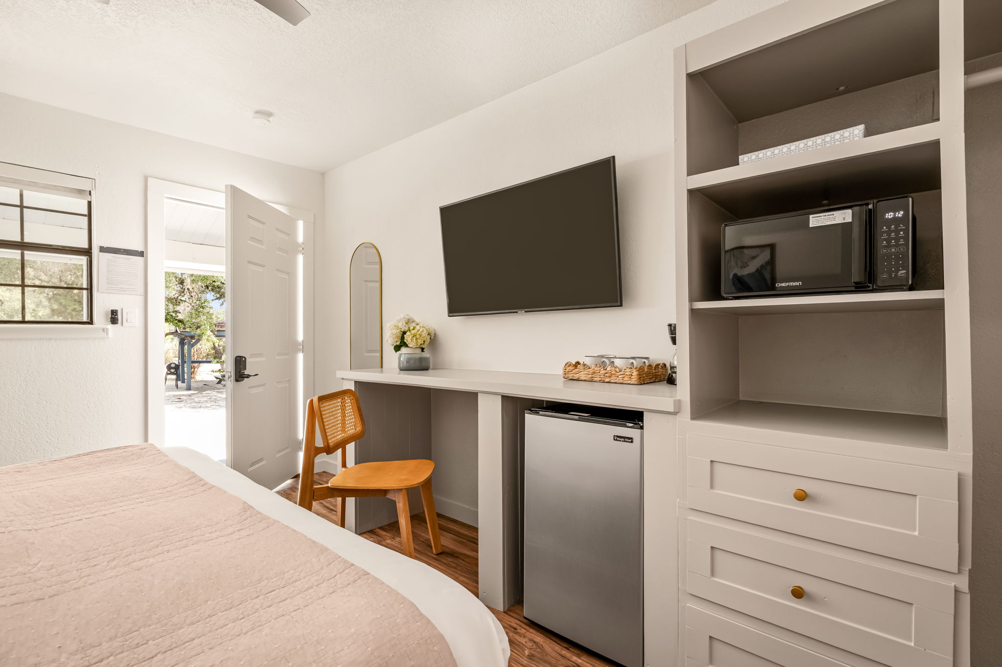 Standard King room with a king bed and wood floors