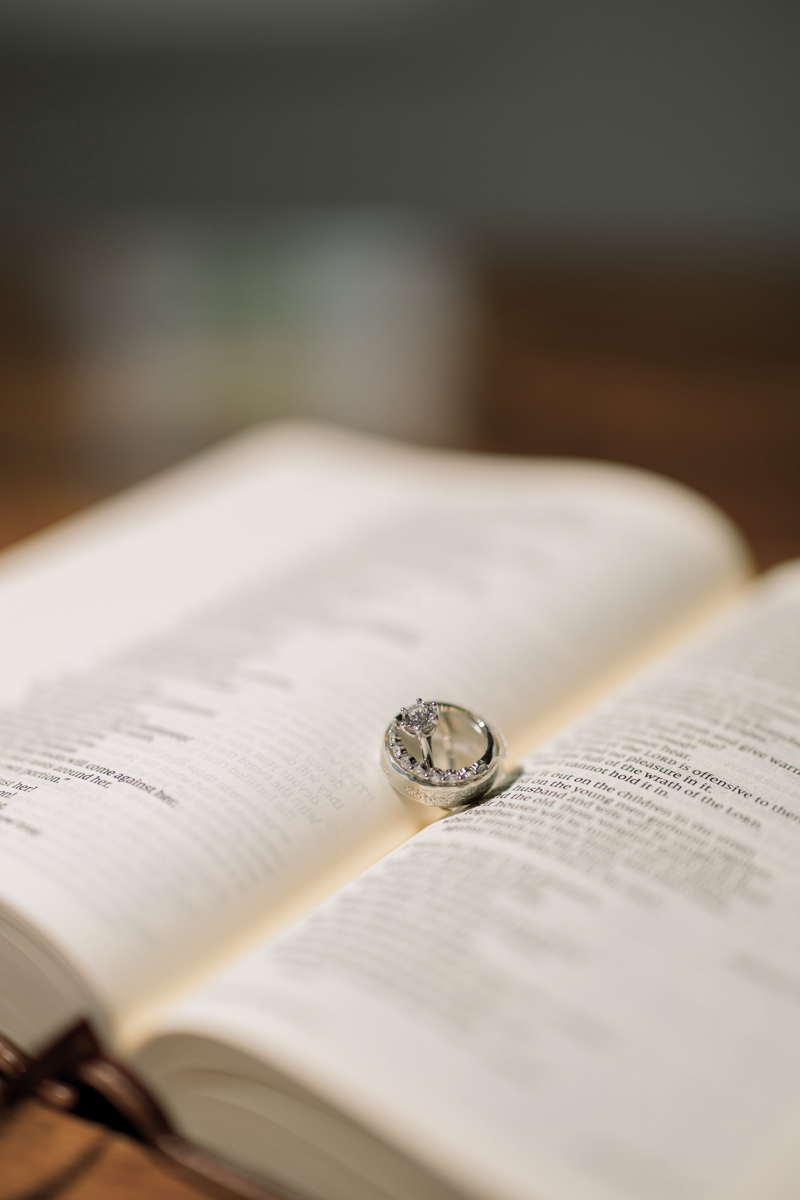 Wedding rings resting on an open book