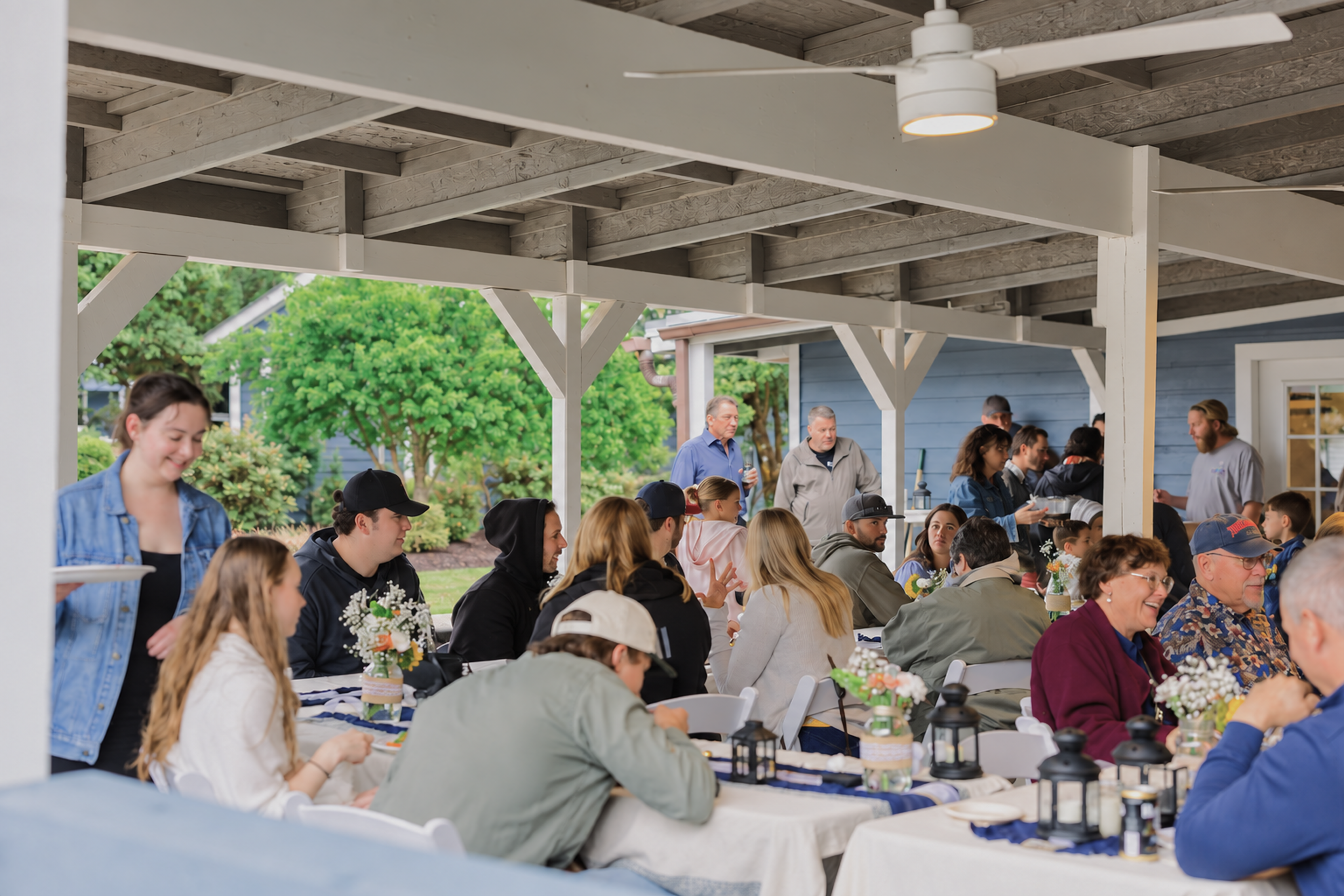 Guests at dinner under the covered patio