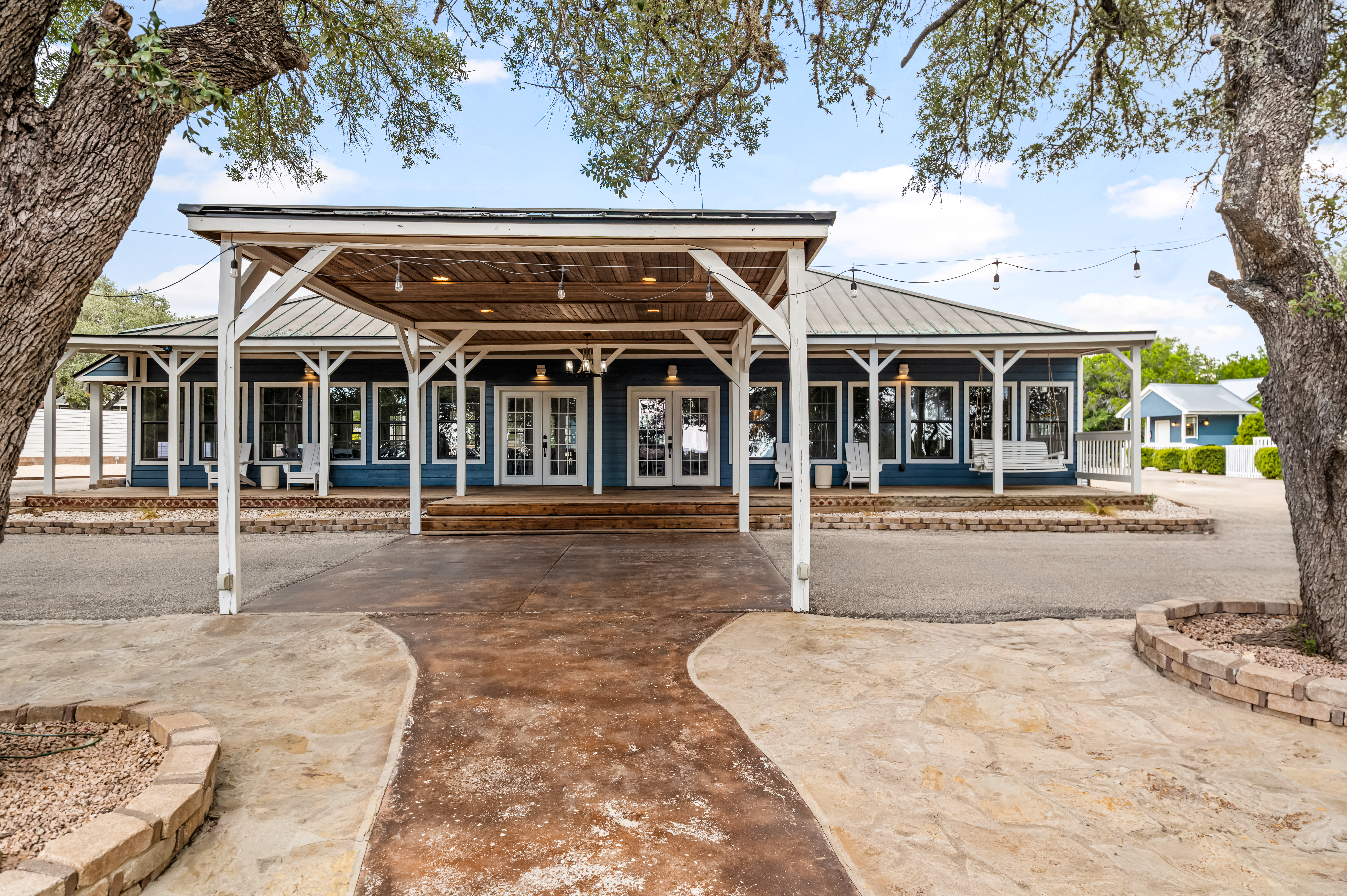 The hall from the front walk, string lights under the covered entrance