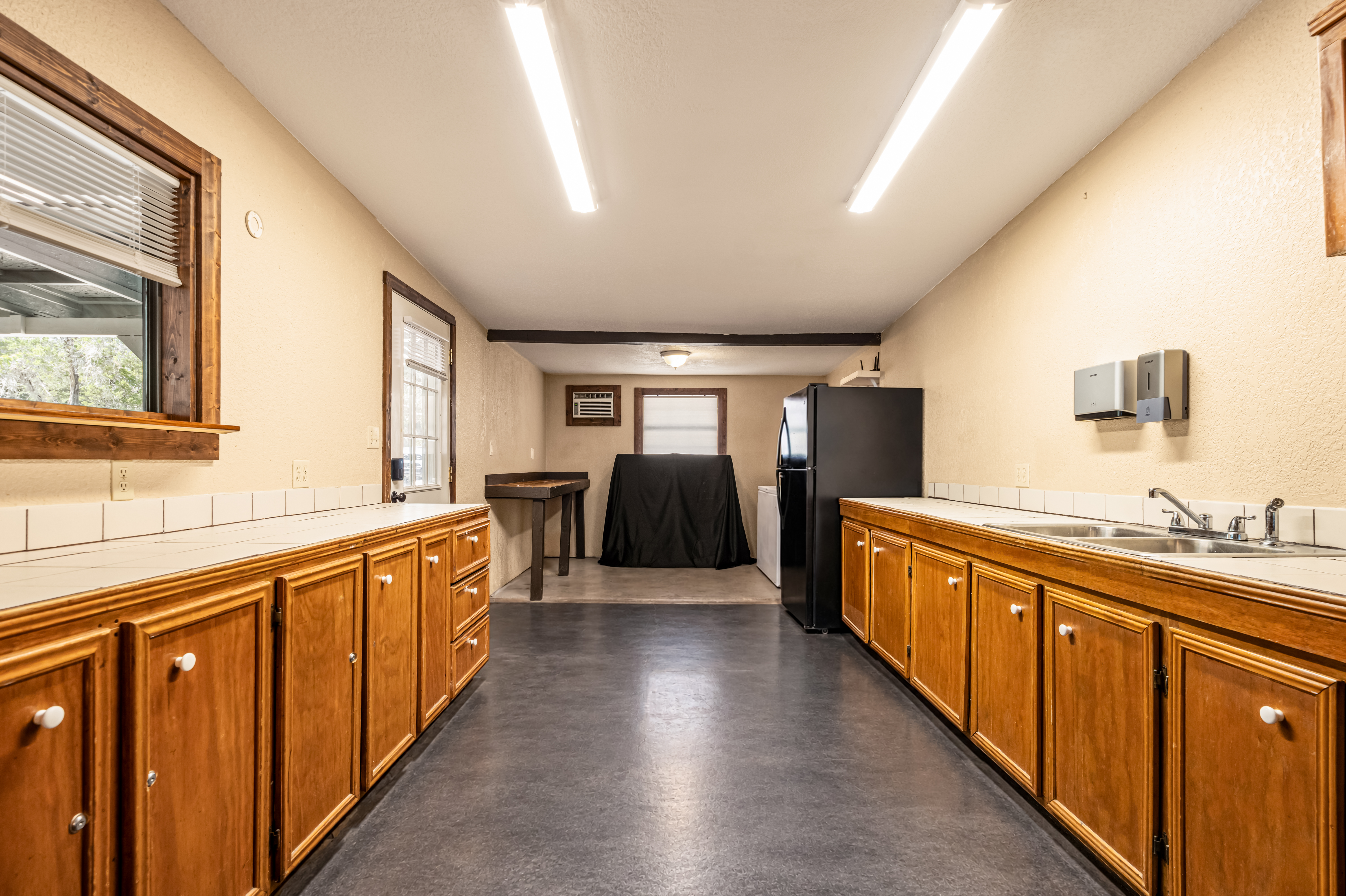 The kitchen galley with double sink and prep counters