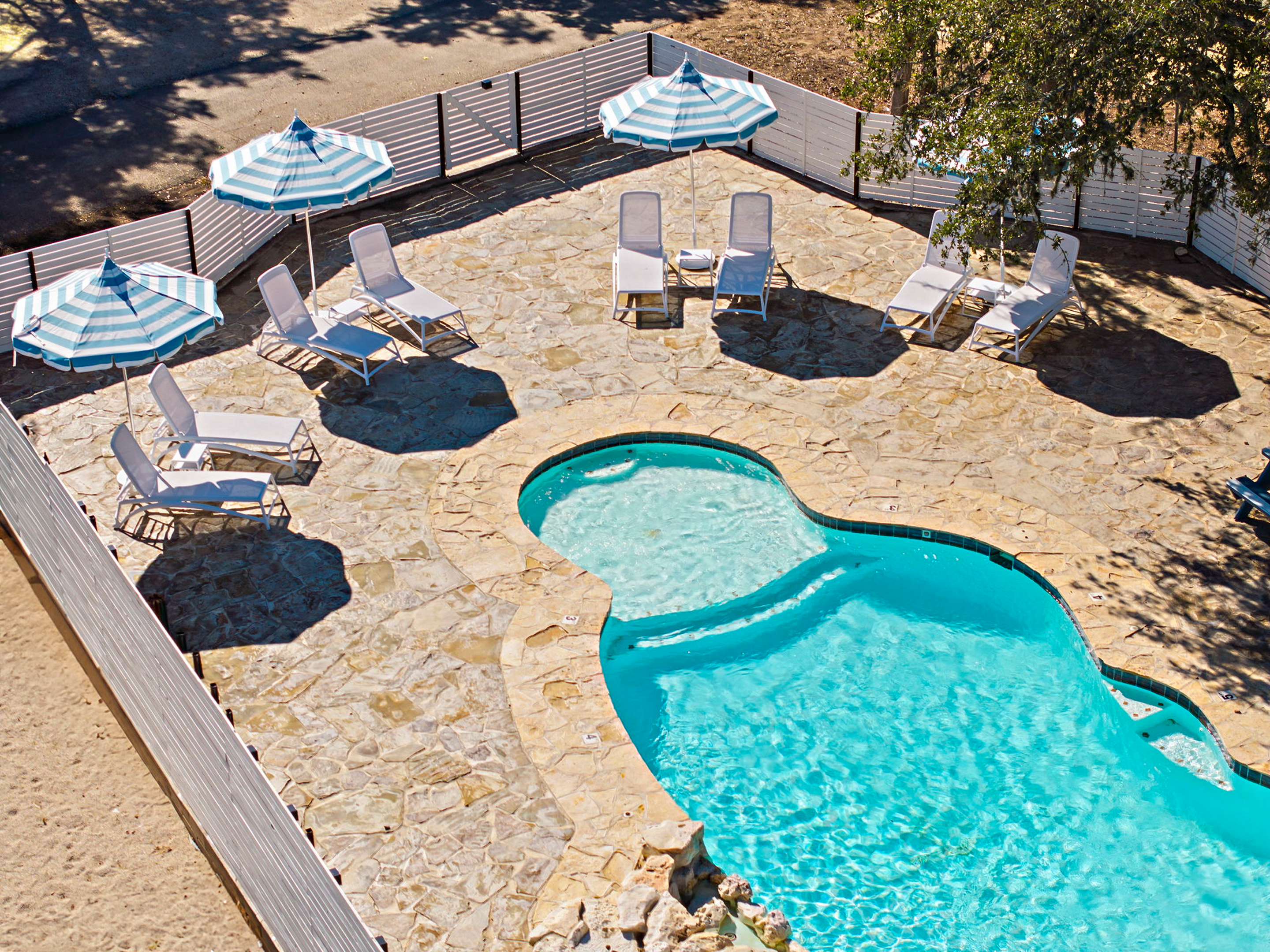 The pool, loungers and sun deck from the air